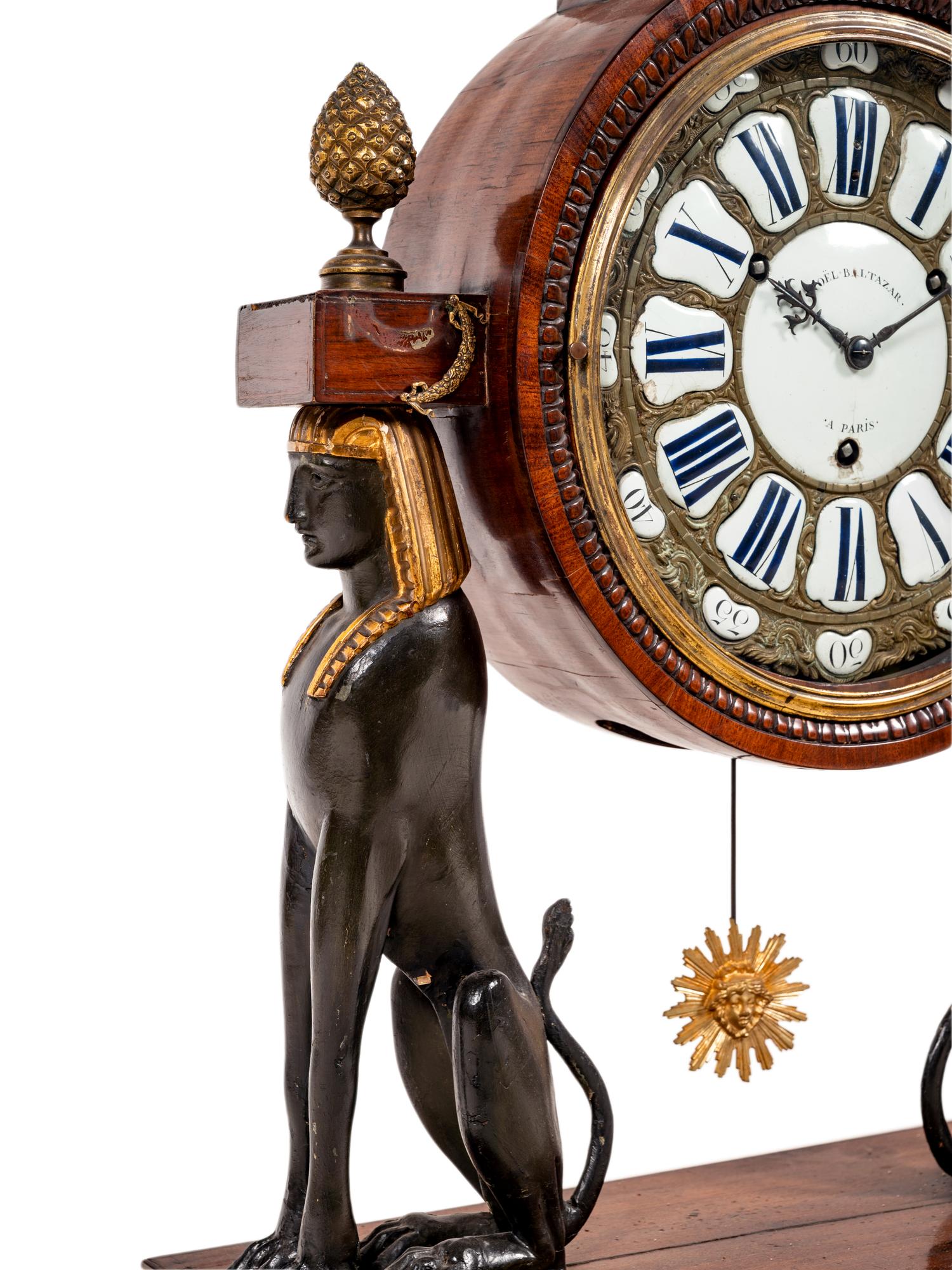 A French Egyptian Revival Gilt Bronze Mounted Mahogany Clock