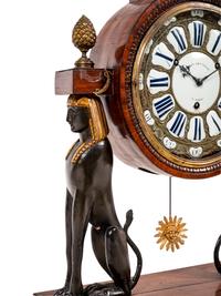 A French Egyptian Revival Gilt Bronze Mounted Mahogany Clock