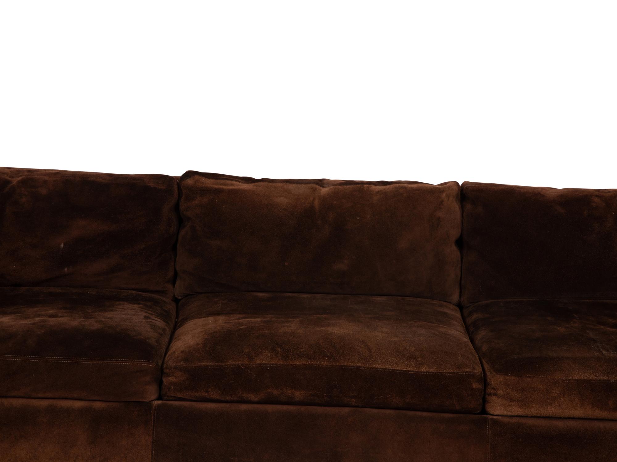 A Chocolate Suede-Upholstered Three-Cushion Sofa