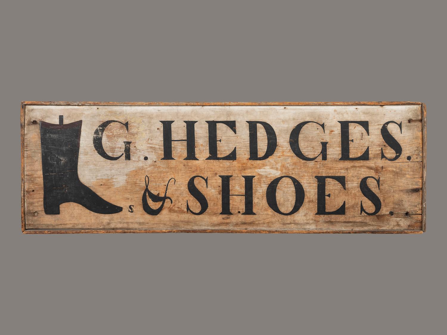 A Black Painted Pine Cobbler's Sign