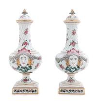 A Pair of Continental Painted and Parcel Gilt Porcelain Urns