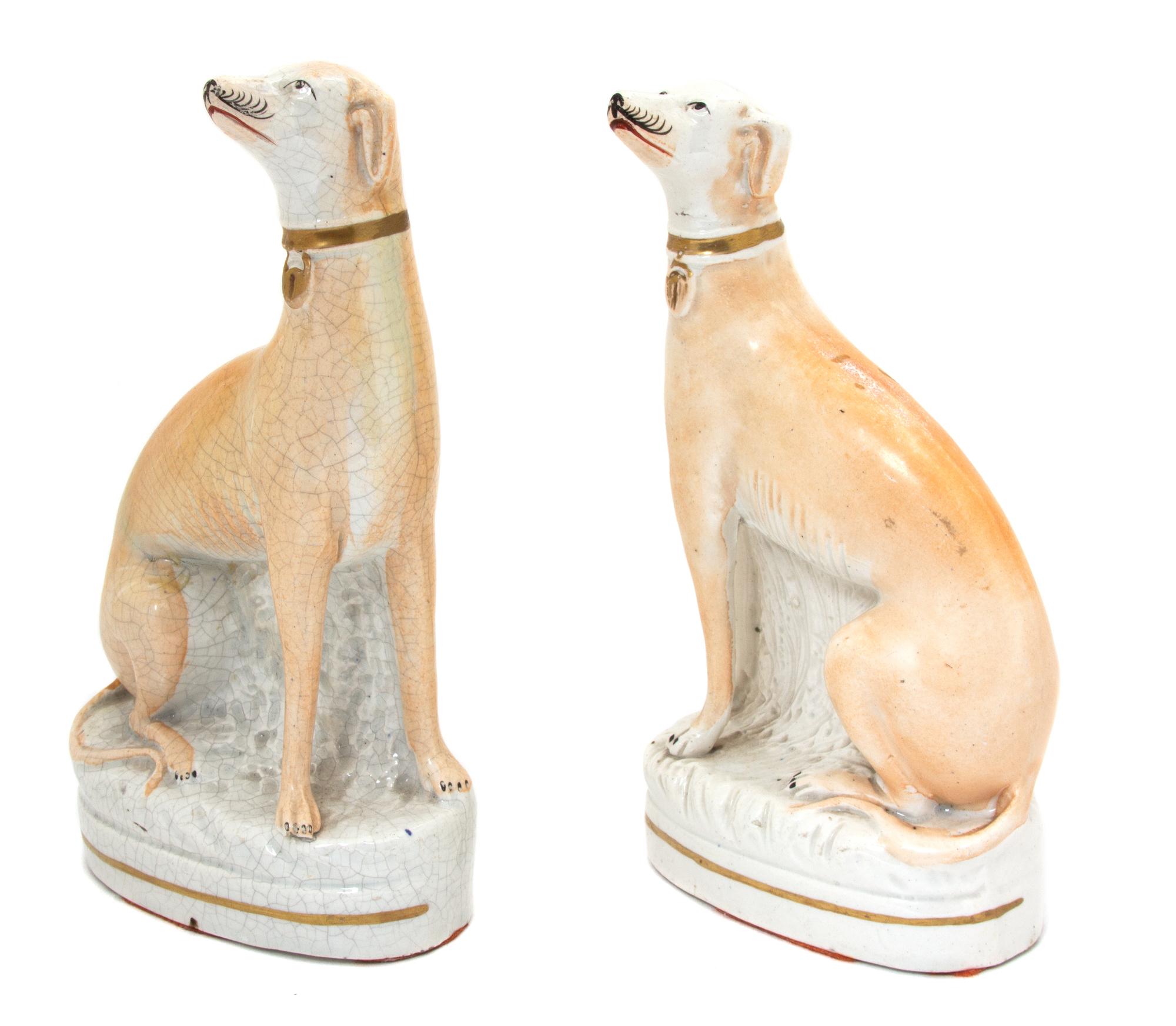 A Pair of Staffordshire Porcelain Models of Greyhounds Height 8 x width 4 1/2 inches. — CIRCA 1810