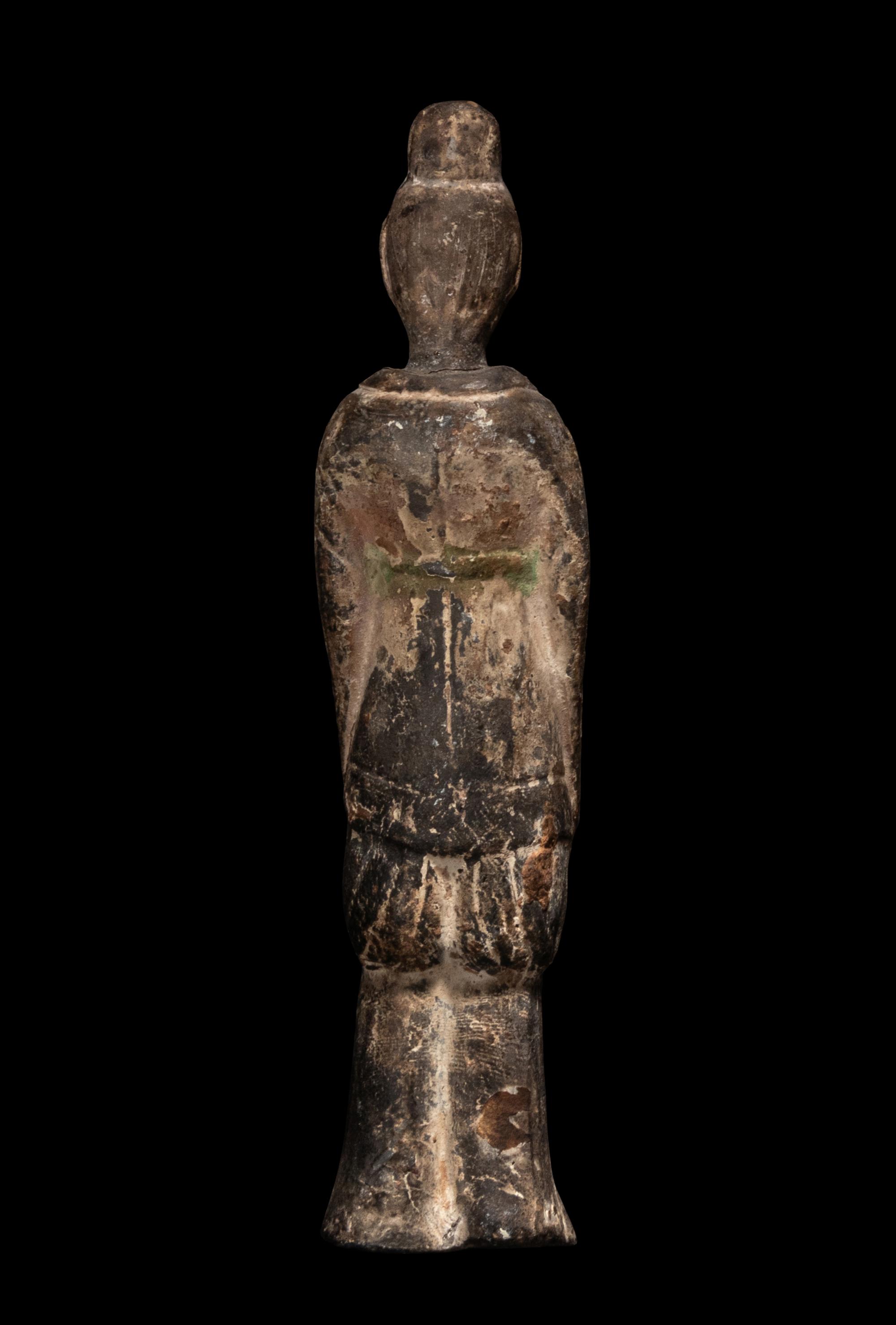 A Chinese Pottery Figure of a Standing Scholar