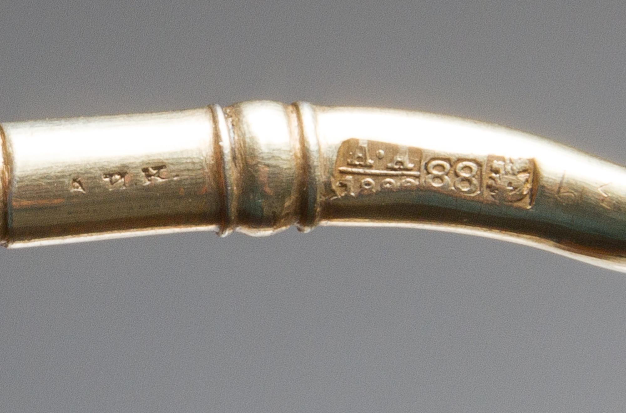 A Russian Silver-Gilt and Enamel Spoon, Maker's mark Cyrillic AHK, assay mark of Anatoly Artsybashev, Moscow, late 19th century, having
