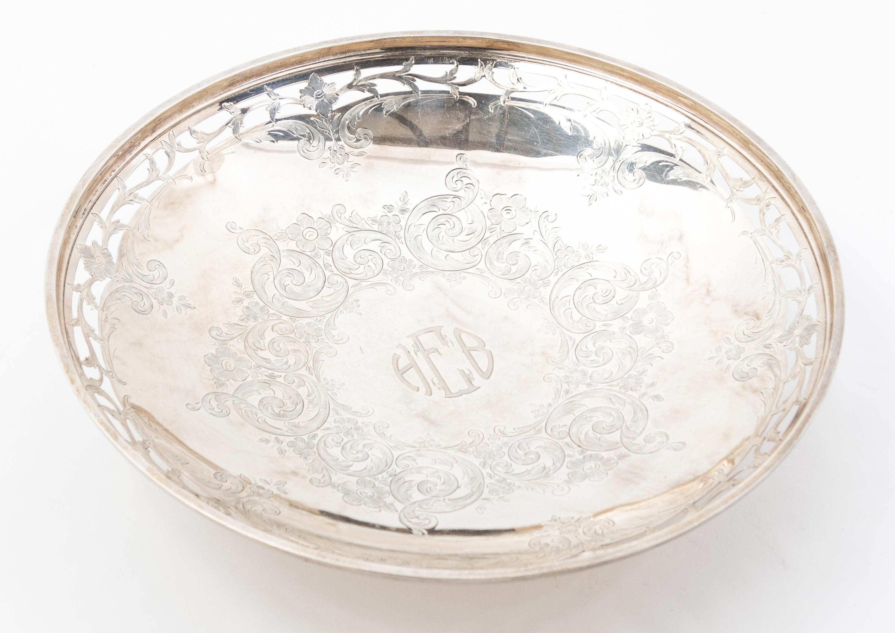 An American Silver Cake Dish, Brock & Co., New York, NY, having a pierced border and the initials HEB centered within a band of flowers