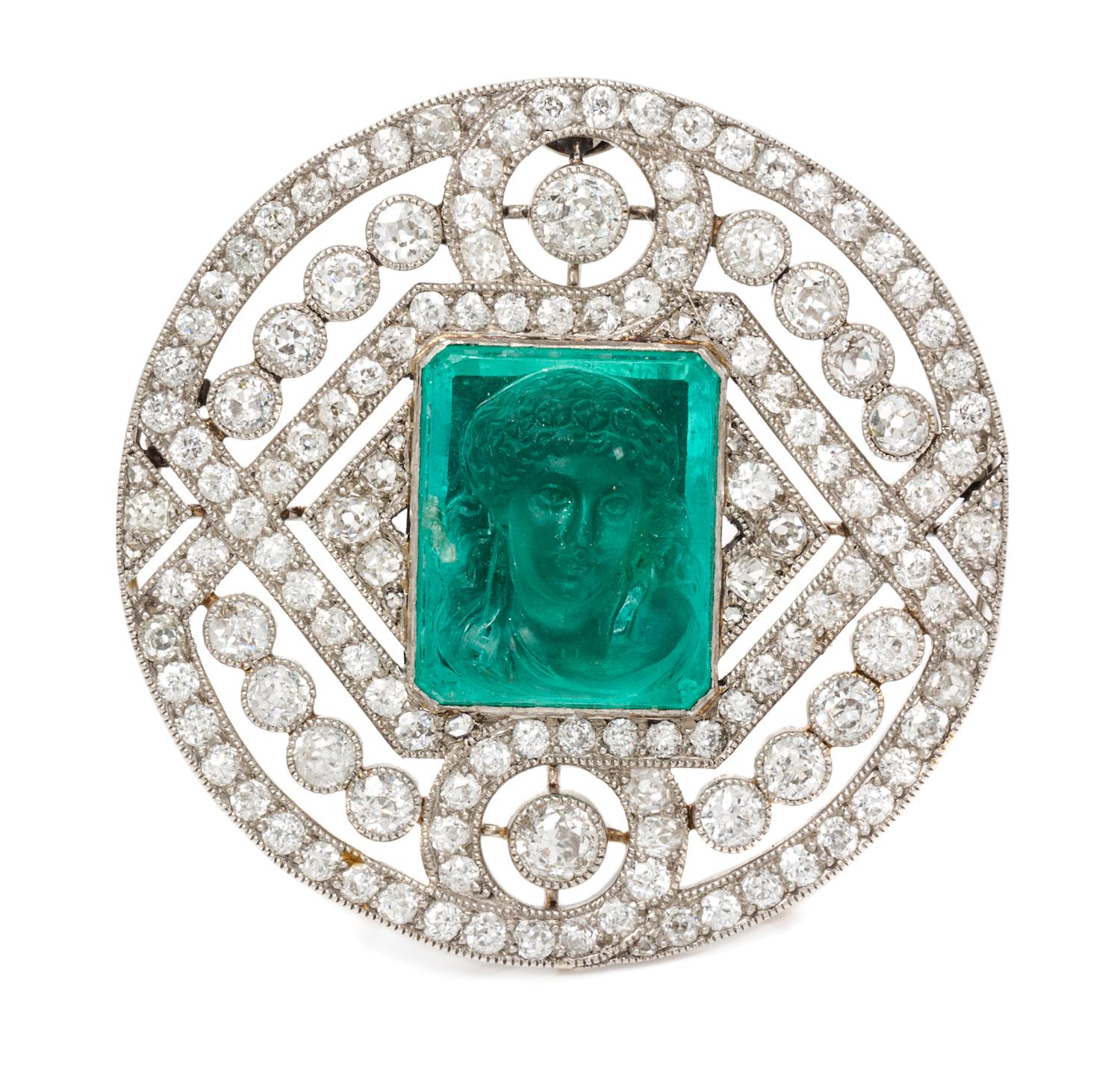 A Platinum, Diamond and Emerald Cameo Brooch, 11.70 dwts.