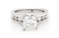 A Platinum, White Gold and Diamond Ring, 6.20 dwts.
