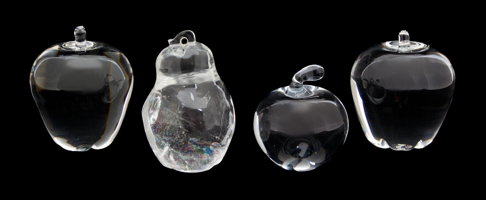 Three Crystal Apples and a Rock Quartz Pear Height of tallest 4 1/4 inches. — 20TH CENTURY
