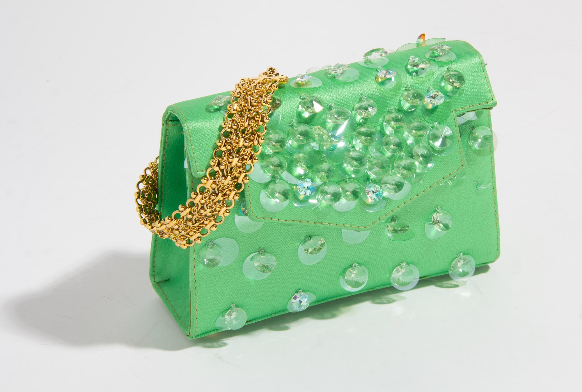 A Gianni Versace Green Silk Wristlet, 5.75" x 4" x 2"; Bracelet: 10" x .75".