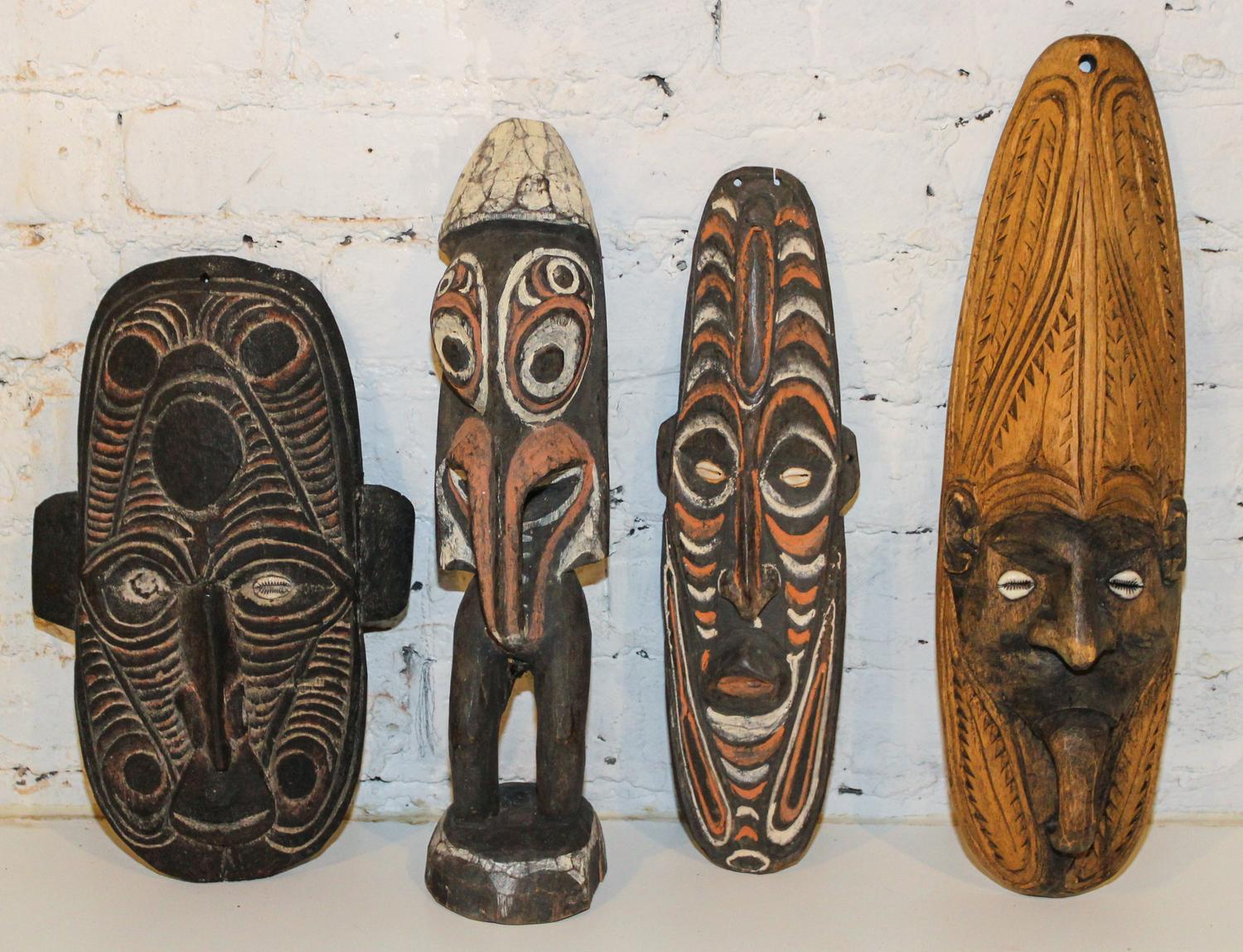 A Group of Sepik River Valley Articles, New Guinea Height of figure 15 1/2 inches.