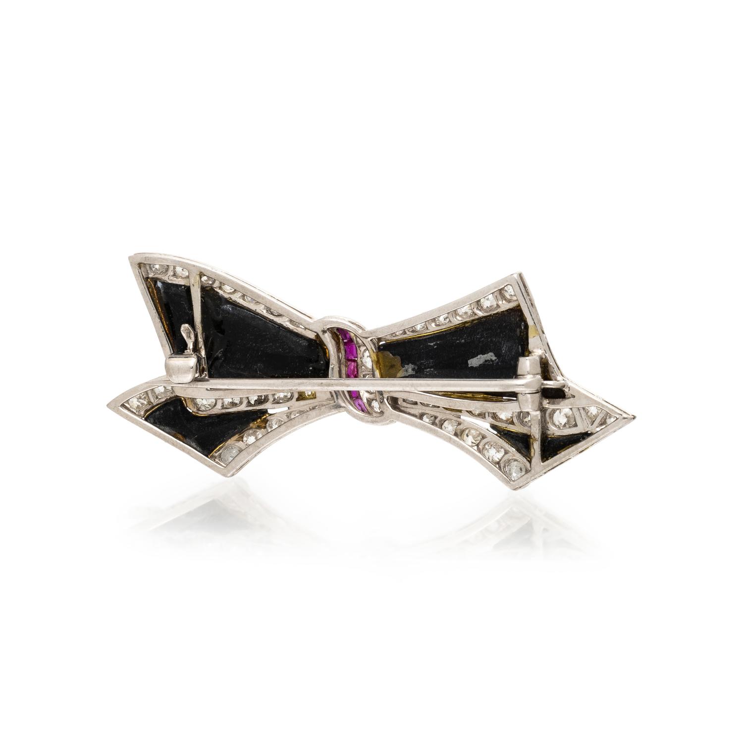 ONYX, RUBY, AND DIAMOND BOW BROOCH