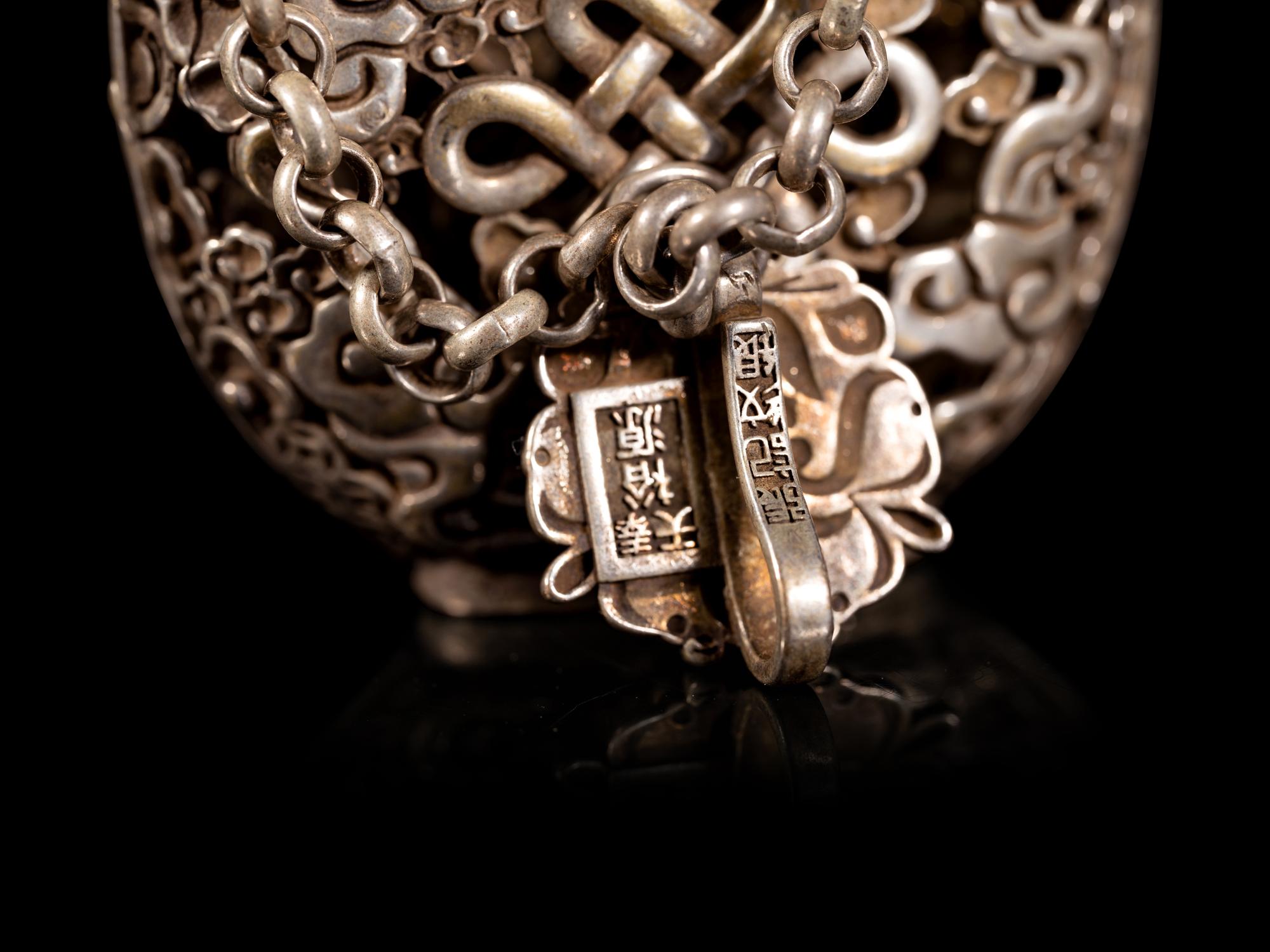 A Chinese Reticulated Silver Snuff Bottle