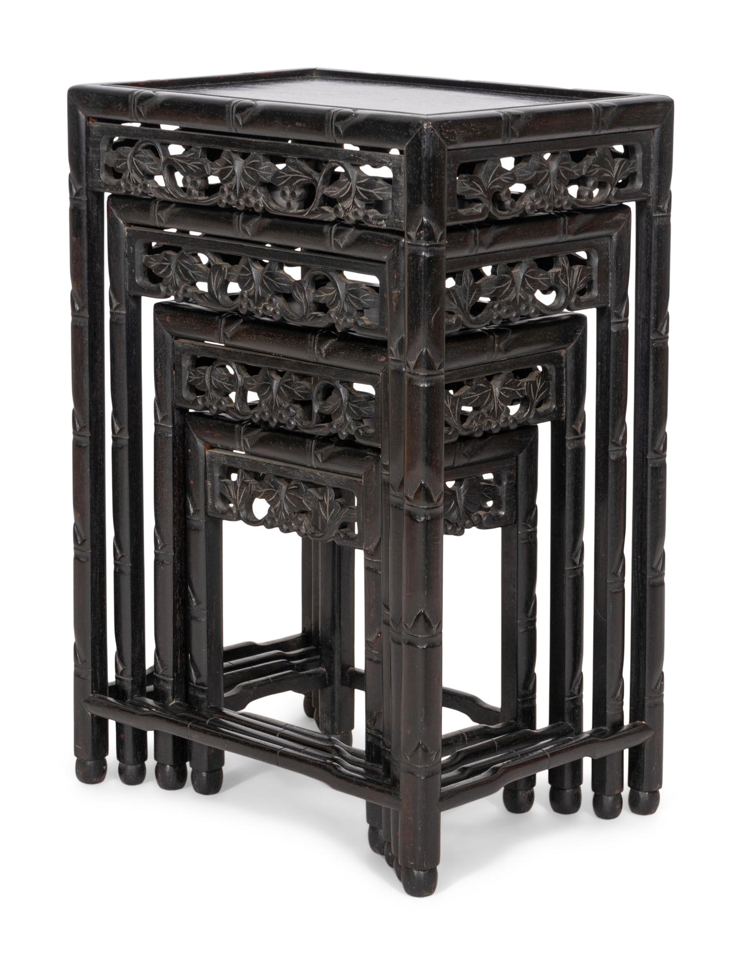 A Set of Four Chinese Ebonized Carved Teak Nesting Tables