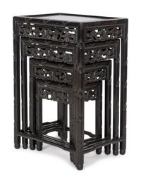 A Set of Four Chinese Ebonized Carved Teak Nesting Tables