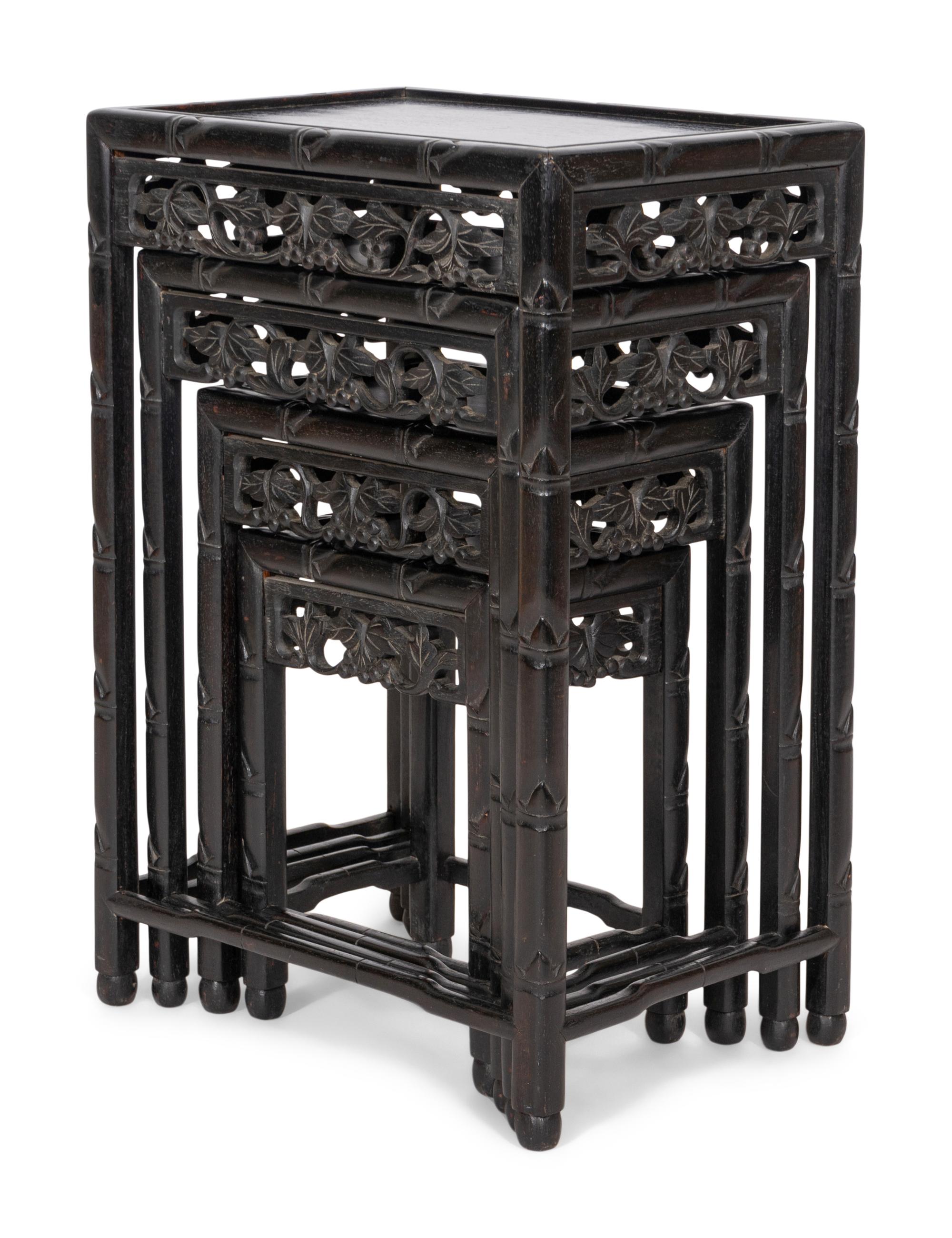 A Set of Four Chinese Ebonized Carved Teak Nesting Tables