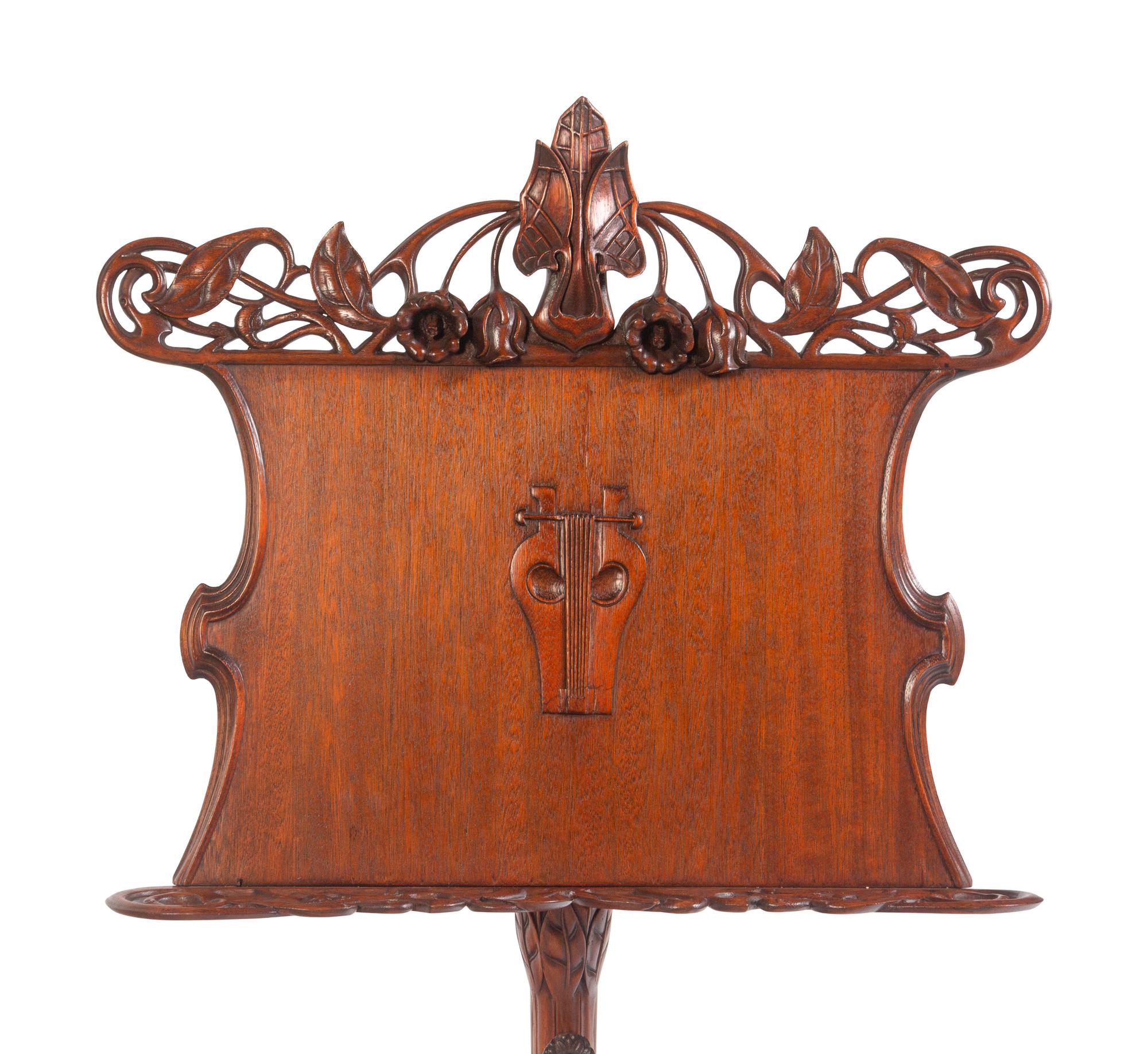 An Art Nouveau Style Carved Walnut Music Stand