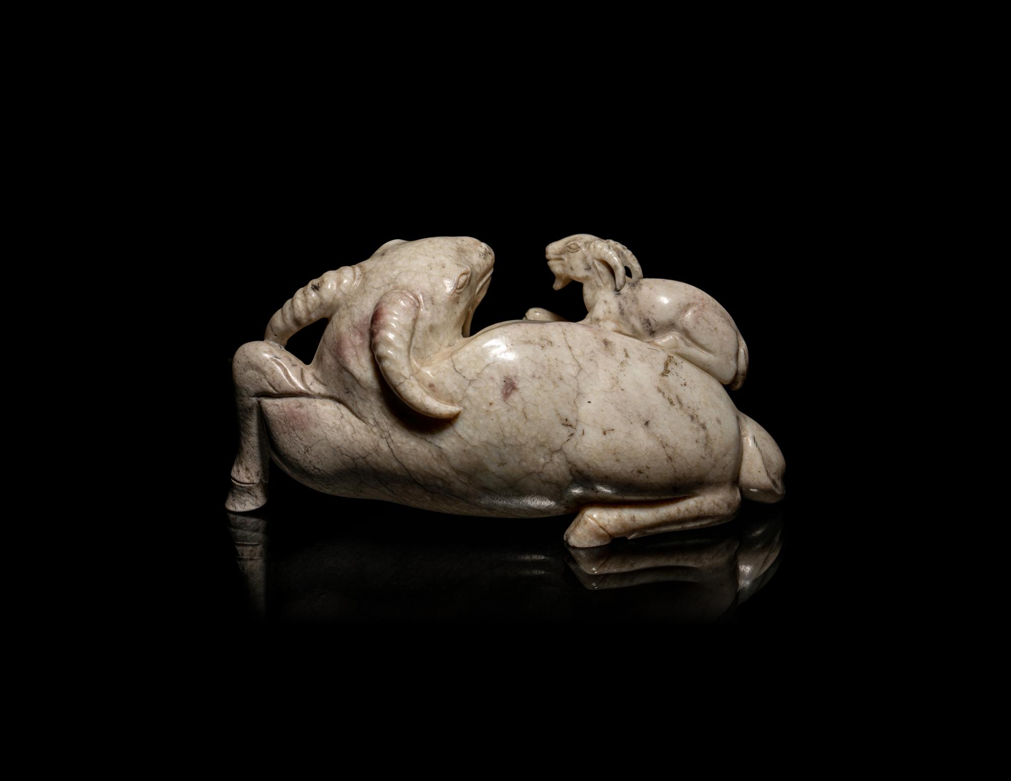 A Chinese Chicken Bone Jade Figural 'Three Rams' Group