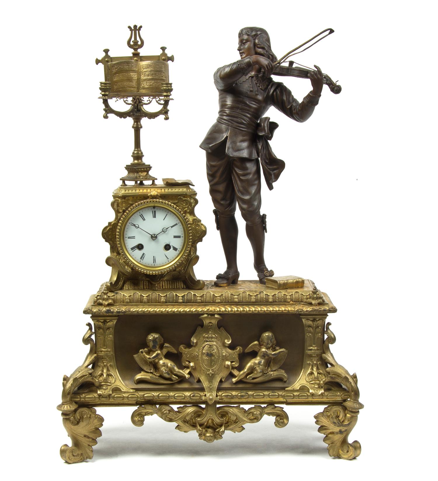 A French Gilt and Patinated Metal Figural Mantel Clock, Height 22 1/4 inches.