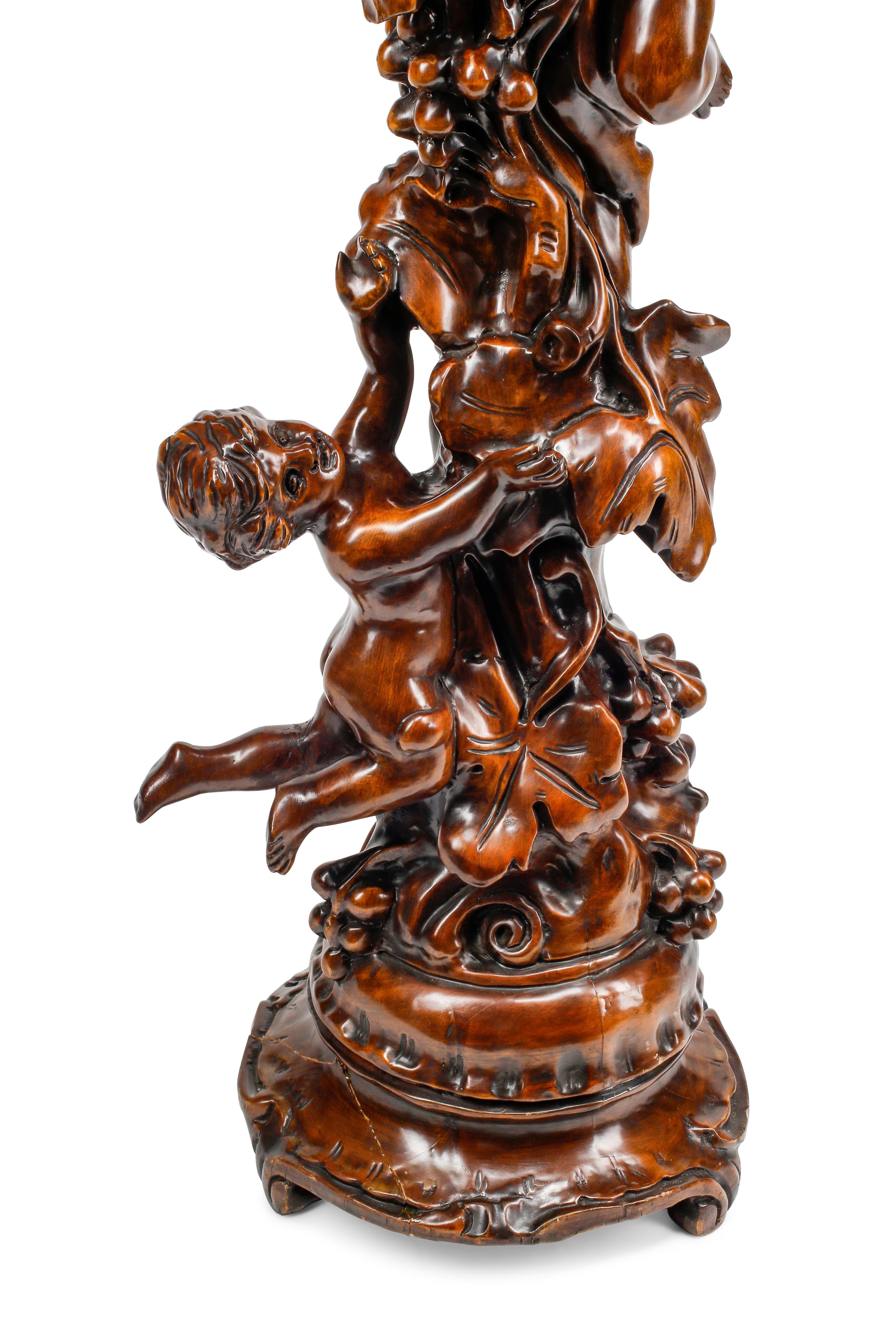 An Italian Baroque Style Carved Wood Jardinière with a Collection of Rock Crystal and Rose Quartz Fruit