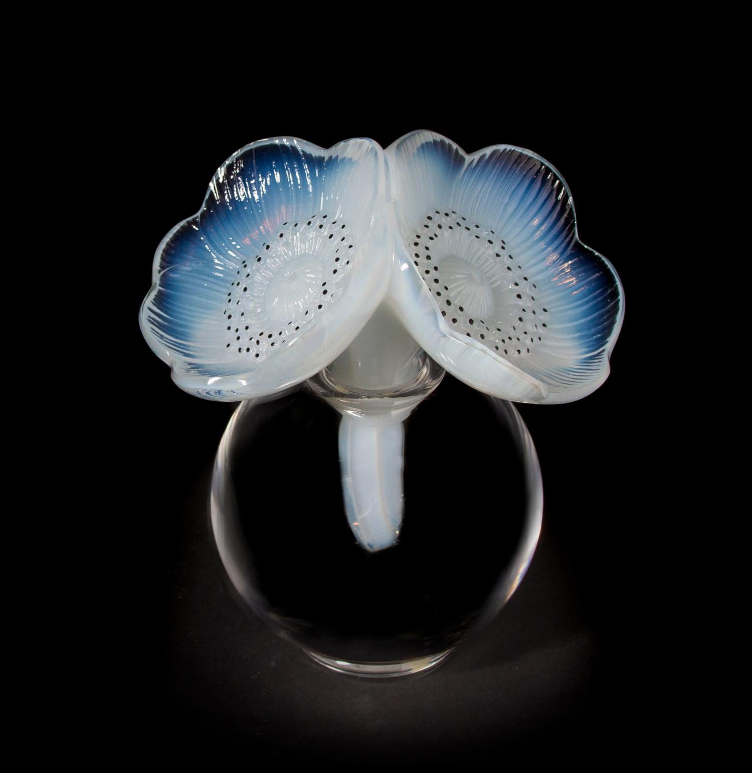 A Lalique Molded and Frosted Glass Perfume Bottle, Height overall 6 1/4 inches.