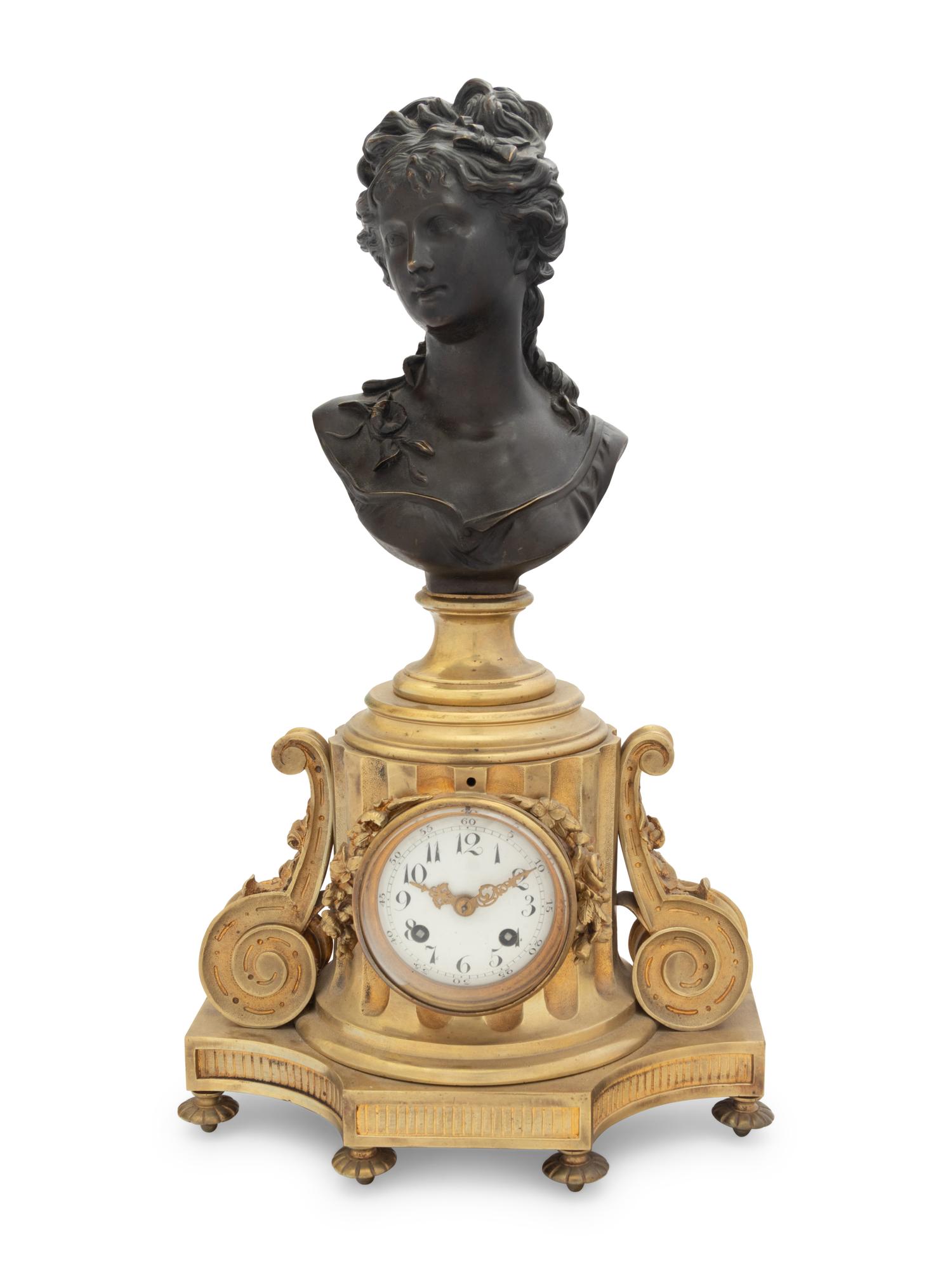 A French Gilt and Patinated Bronze Clock with a Bust of a Lady