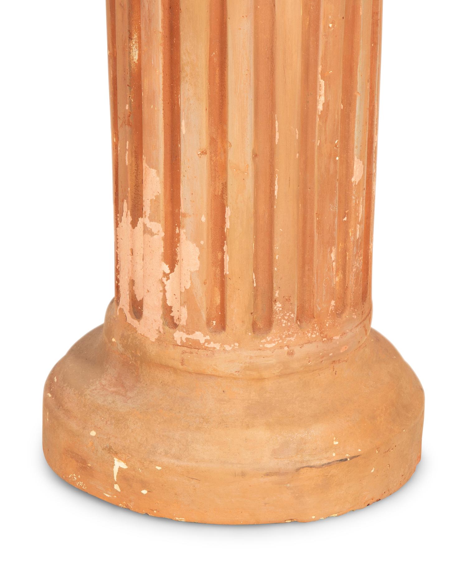 A Pair of Terracotta Busts on Pedestals