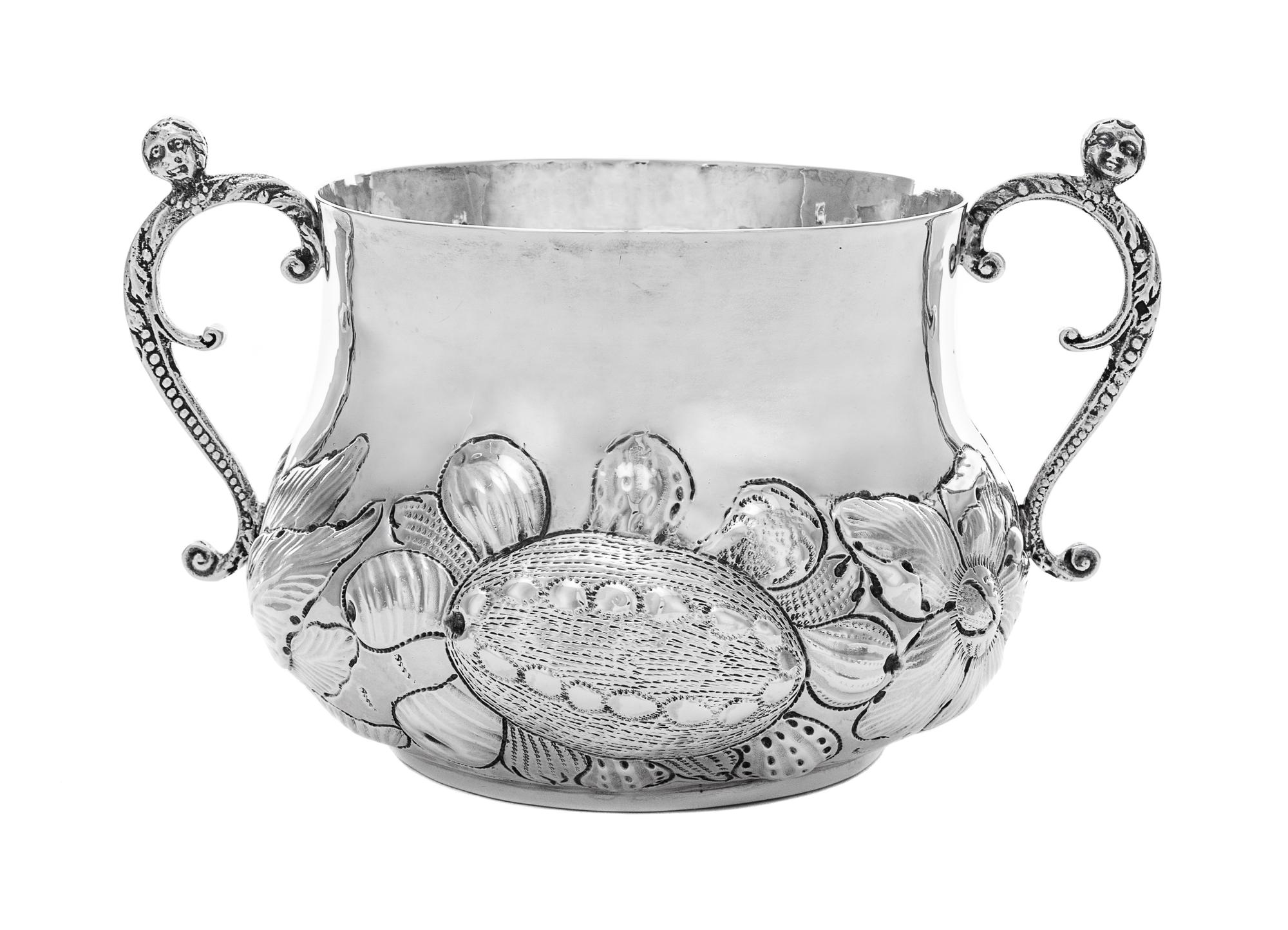 A Charles II Silver Two-Handled Caudle Cup, Osmond Shickland, London, 1663, the ovoid body with repousse fruit and foliate motifs, with