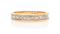 A 14 Karat Yellow Gold and Diamond Band, 2.10 dwts.