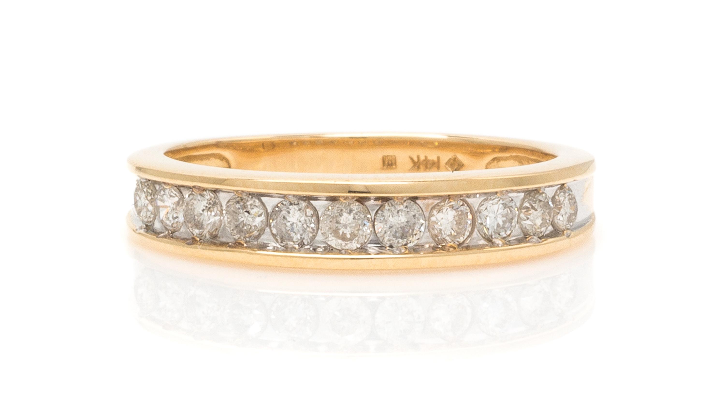 A 14 Karat Yellow Gold and Diamond Band, 2.10 dwts.