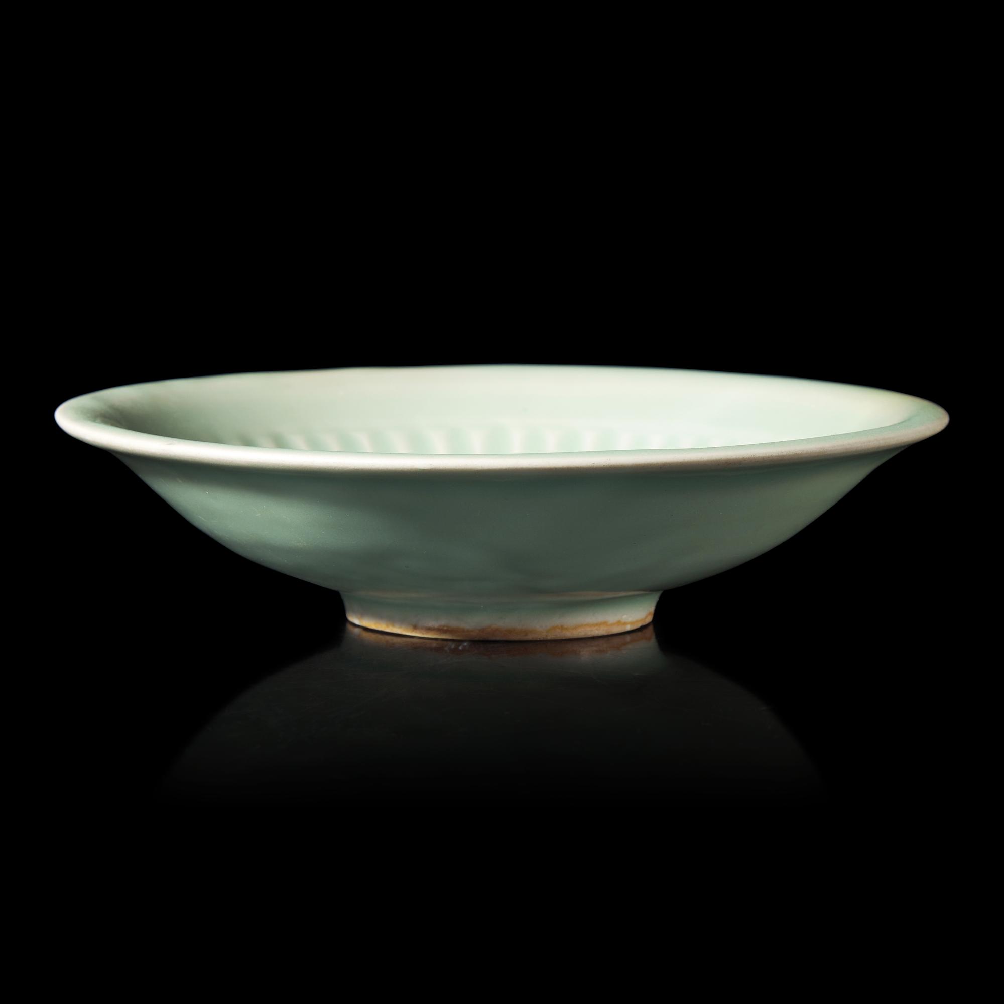 A Chinese Longquan Celadon Glazed Dish, 13th/14th Century 宋/元 龍泉窯梅子青釉碟