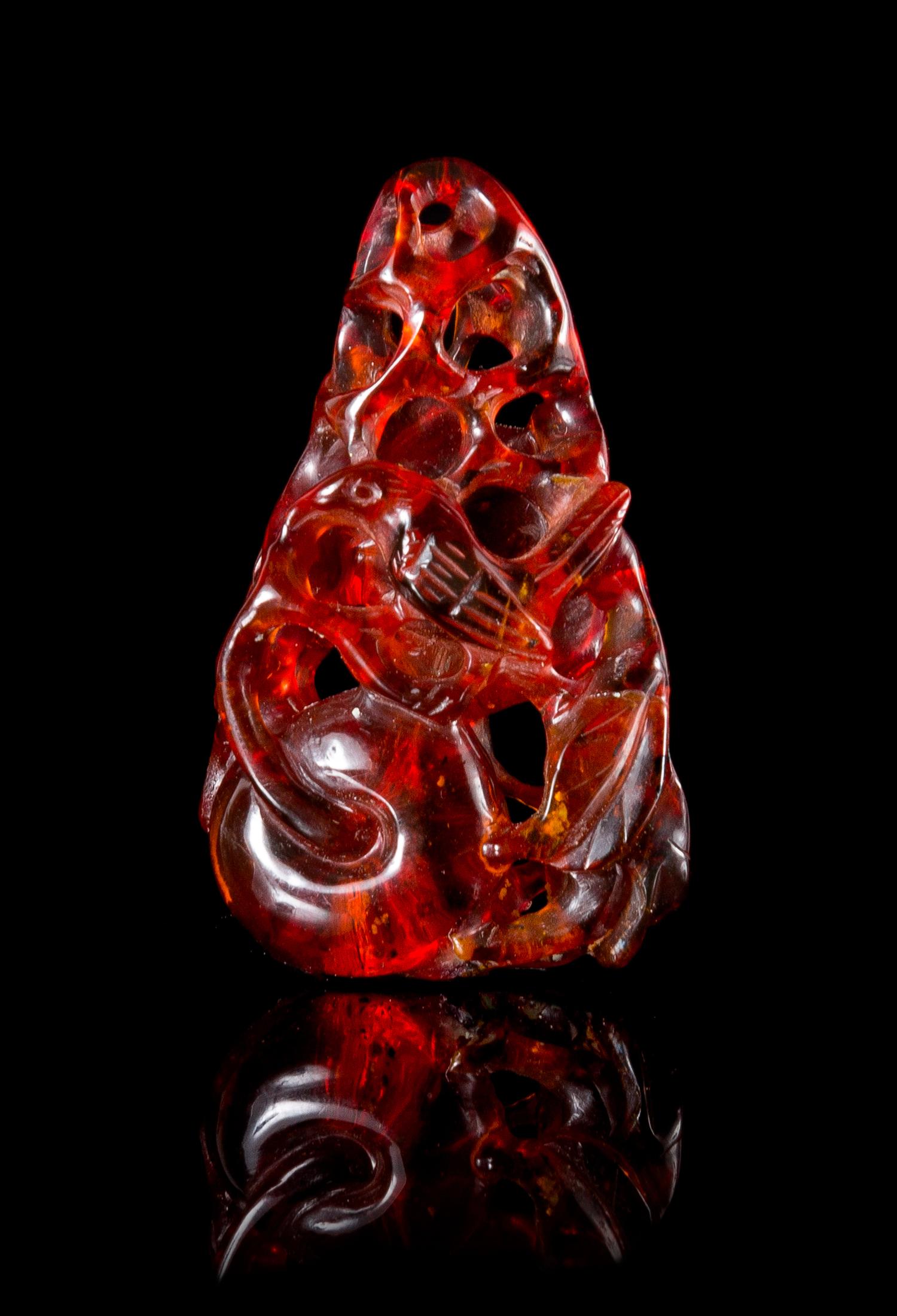 A Carved Amber Toggle Height 2 inches.