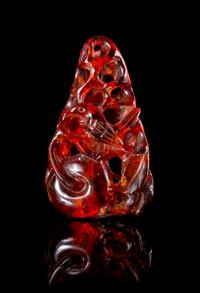A Carved Amber Toggle Height 2 inches.