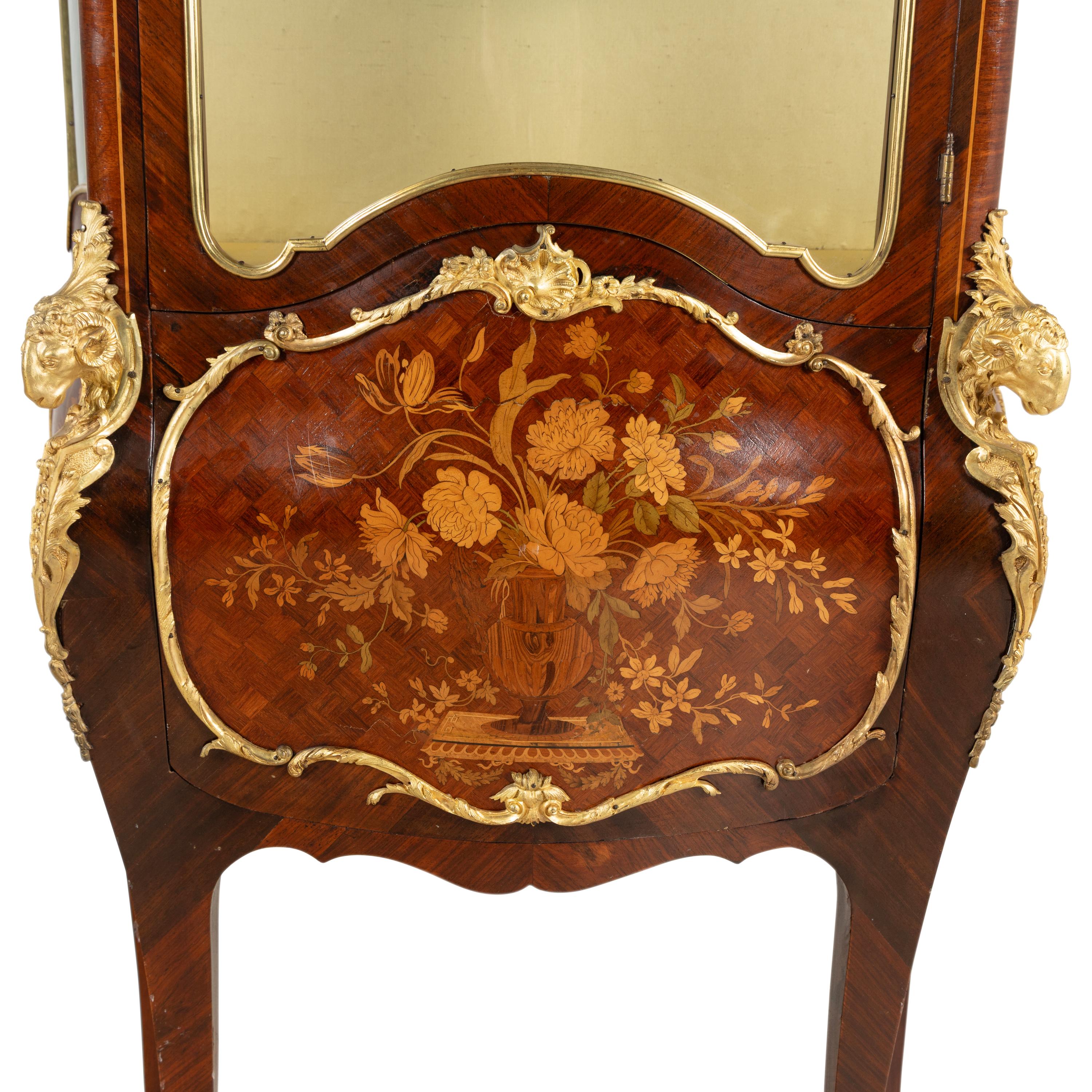 A Louis XV Style Gilt Bronze Mounted Marquetry Bombé Vitrine