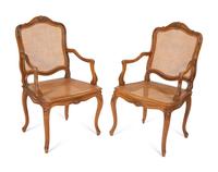 A Pair of Louis XV Style Caned Beechwood Fauteuils