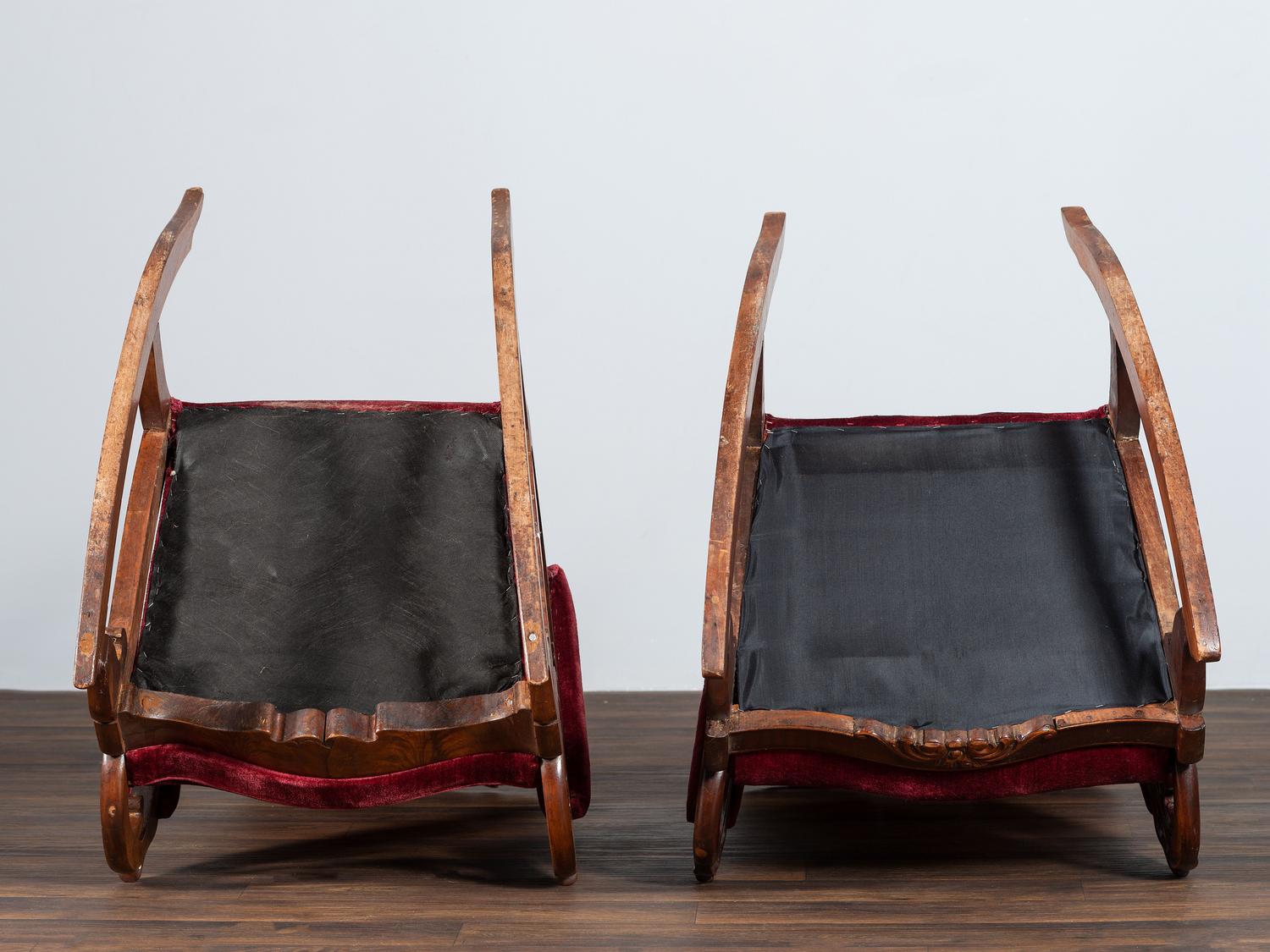 A Matched Pair of Victorian Carved Walnut Rocker Armchairs