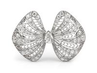 An Art Deco Platinum and Diamond Bow Motif Brooch, 5.90 dwts.