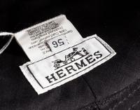 An Hermes Black Fabric and Metallic Leather Hat, Size 56.