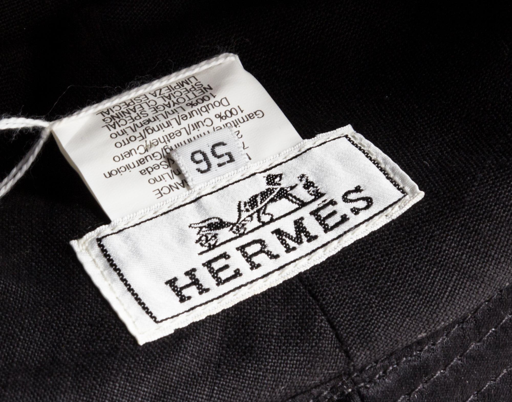 An Hermes Black Fabric and Metallic Leather Hat, Size 56.
