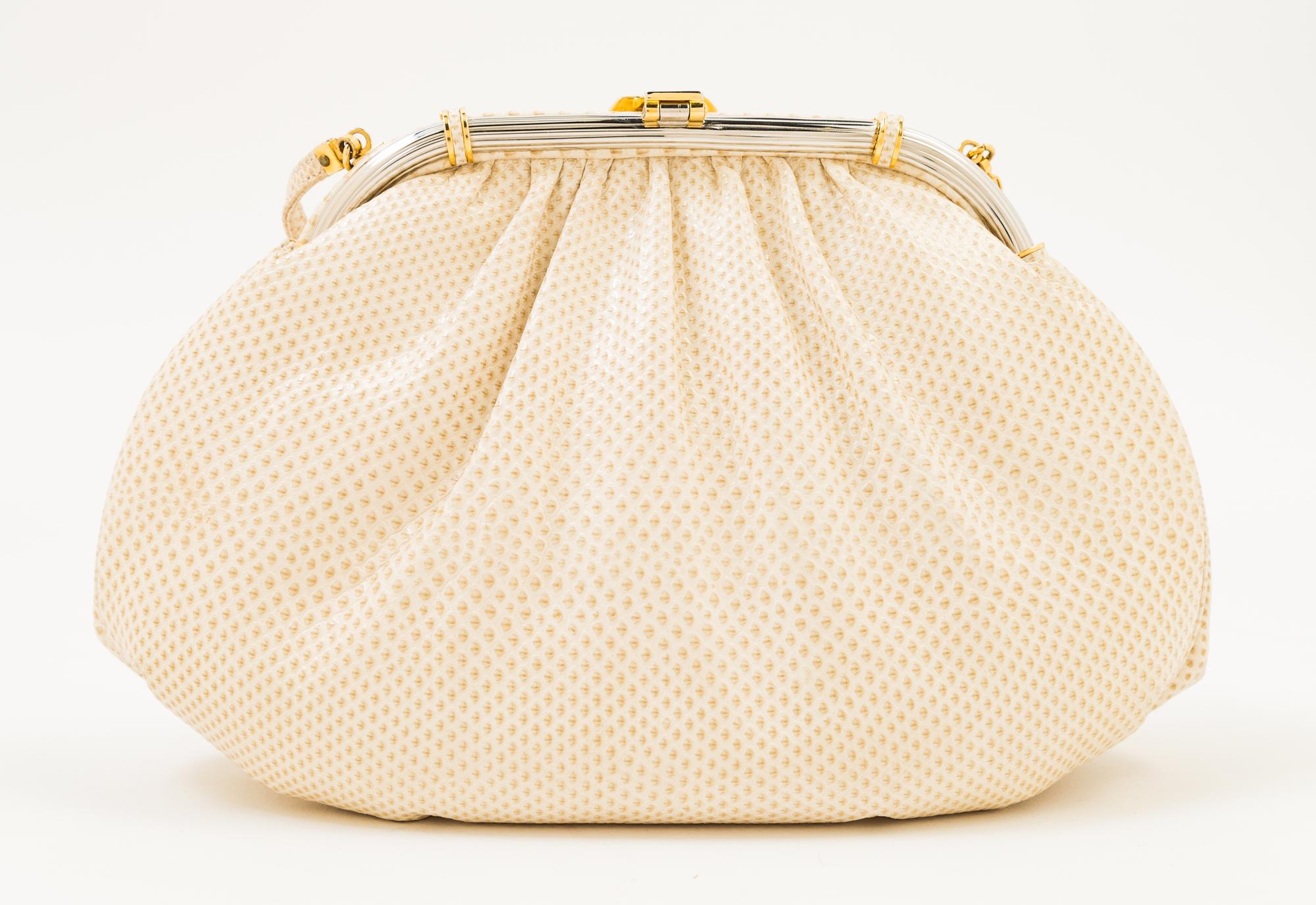 A Judith Leiber Ivory Snakeskin Clutch, 9.5" x 6" x 1.5".