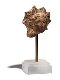 A Greek Terracotta Head of Helios