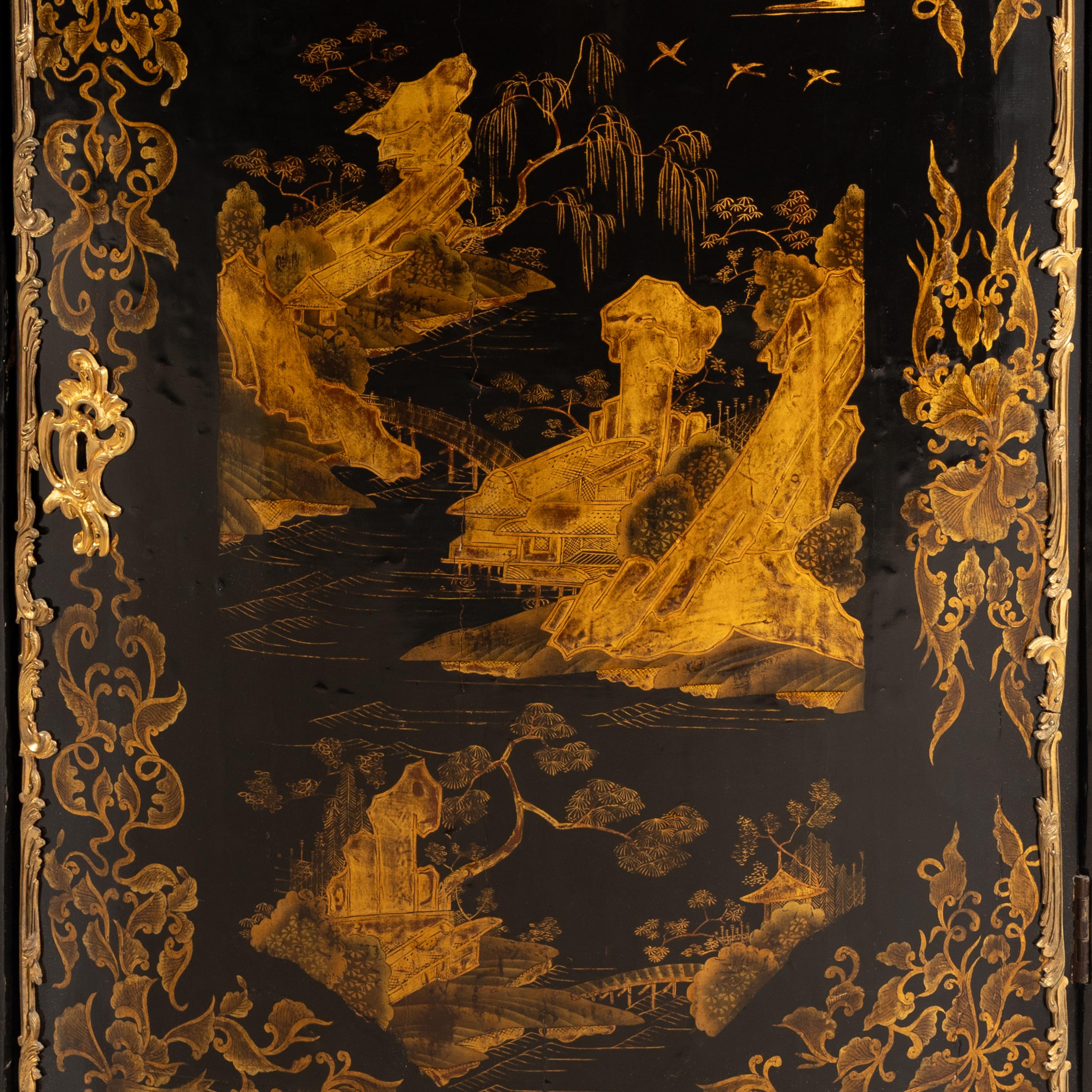 A Pair of Louis XV Chinese and European Lacquer and Gilt Bronze Mounted Encoignures
