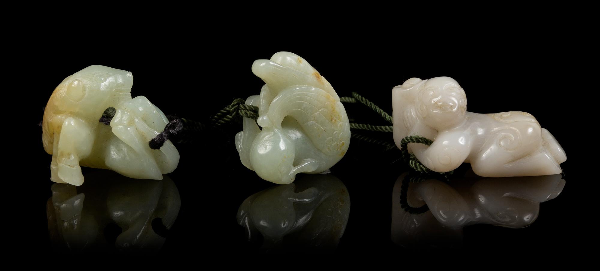Three Carved Jade Pendants Length of longest 2 inches.
