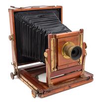 A Wood Cased Field Camera Height of case 9 1/2 x width 8 1/2 inches.