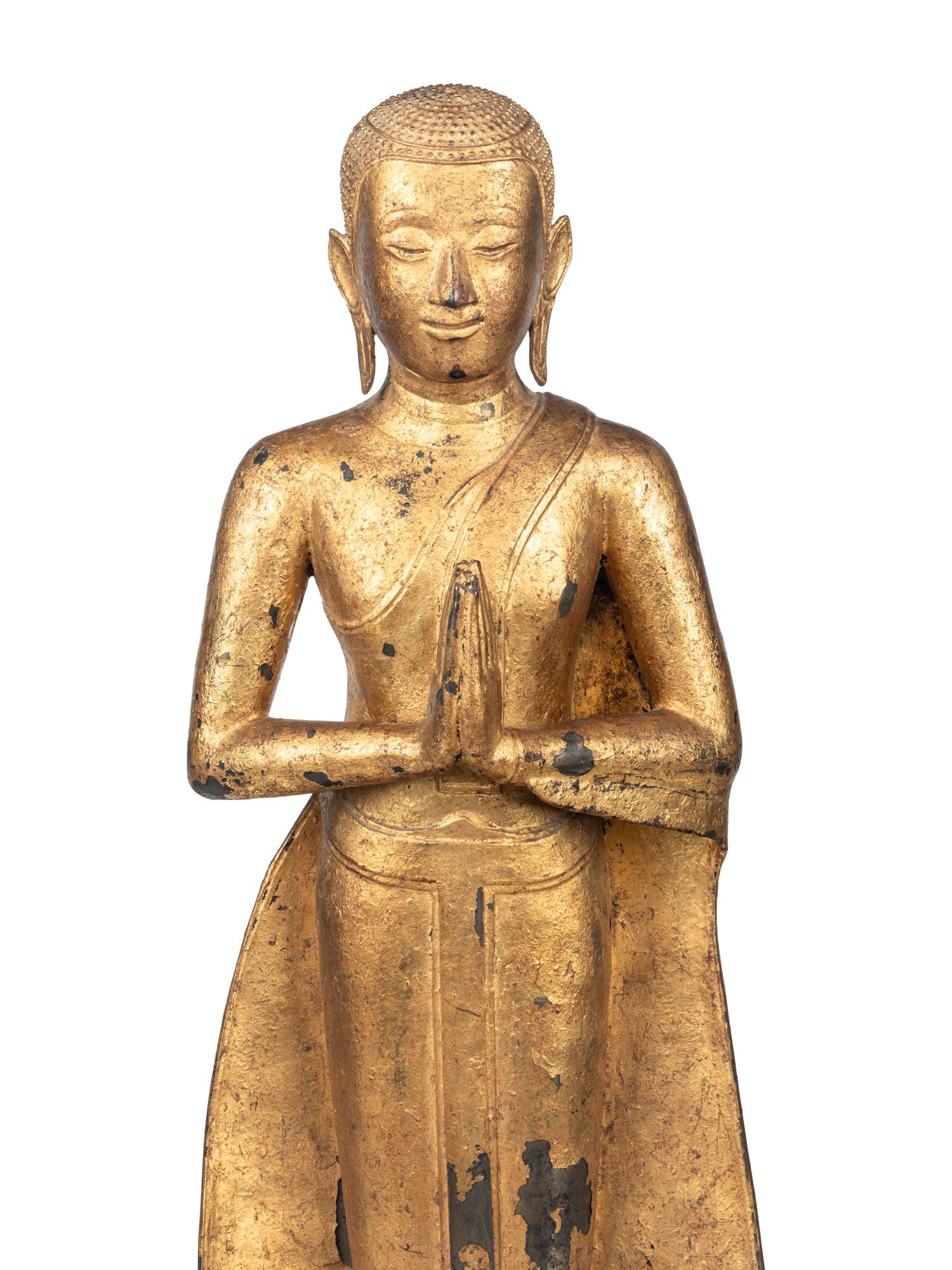 A Gilt Metal Buddha on Stand