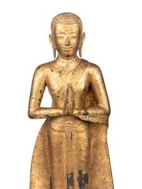 A Gilt Metal Buddha on Stand