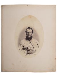 [CIVIL WAR]. Albumen photograph of Private Rufus T. Giffin, Company M, 14th Regiment New York, Heavy Artillery, wounded Fort Steadman, Virginia, 25 March 1865, infection of left hand, photographed and assembled by Reed Brockway Bontecou, M.D.