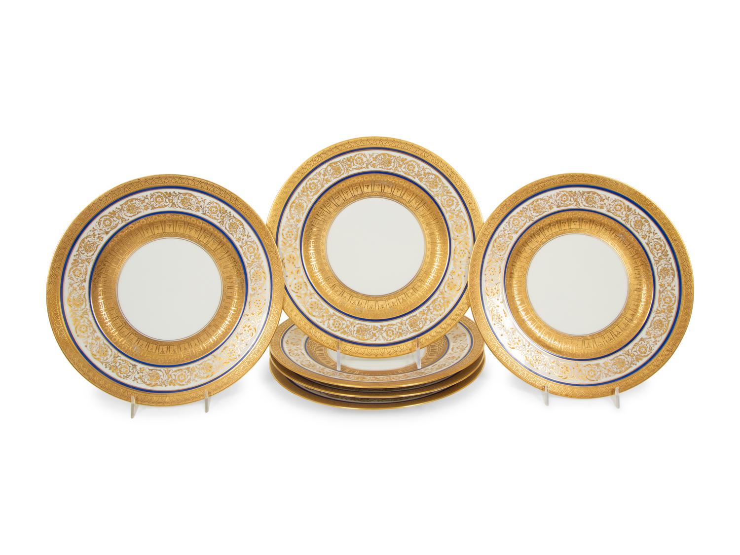 A Set of Twelve Hutschenreuther Gilt Decorated White and Cobalt GLazed Porcelain Dinner Plates