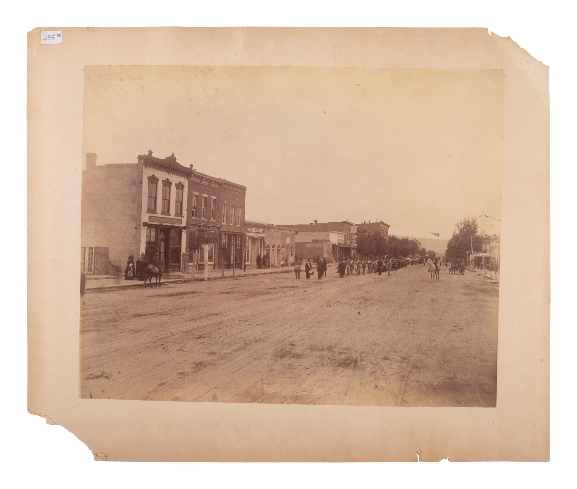 [WESTERN AMERICANA]. [JACKSON, W.H., photog.]. 2 photographs, incl. street scene and railroad view.