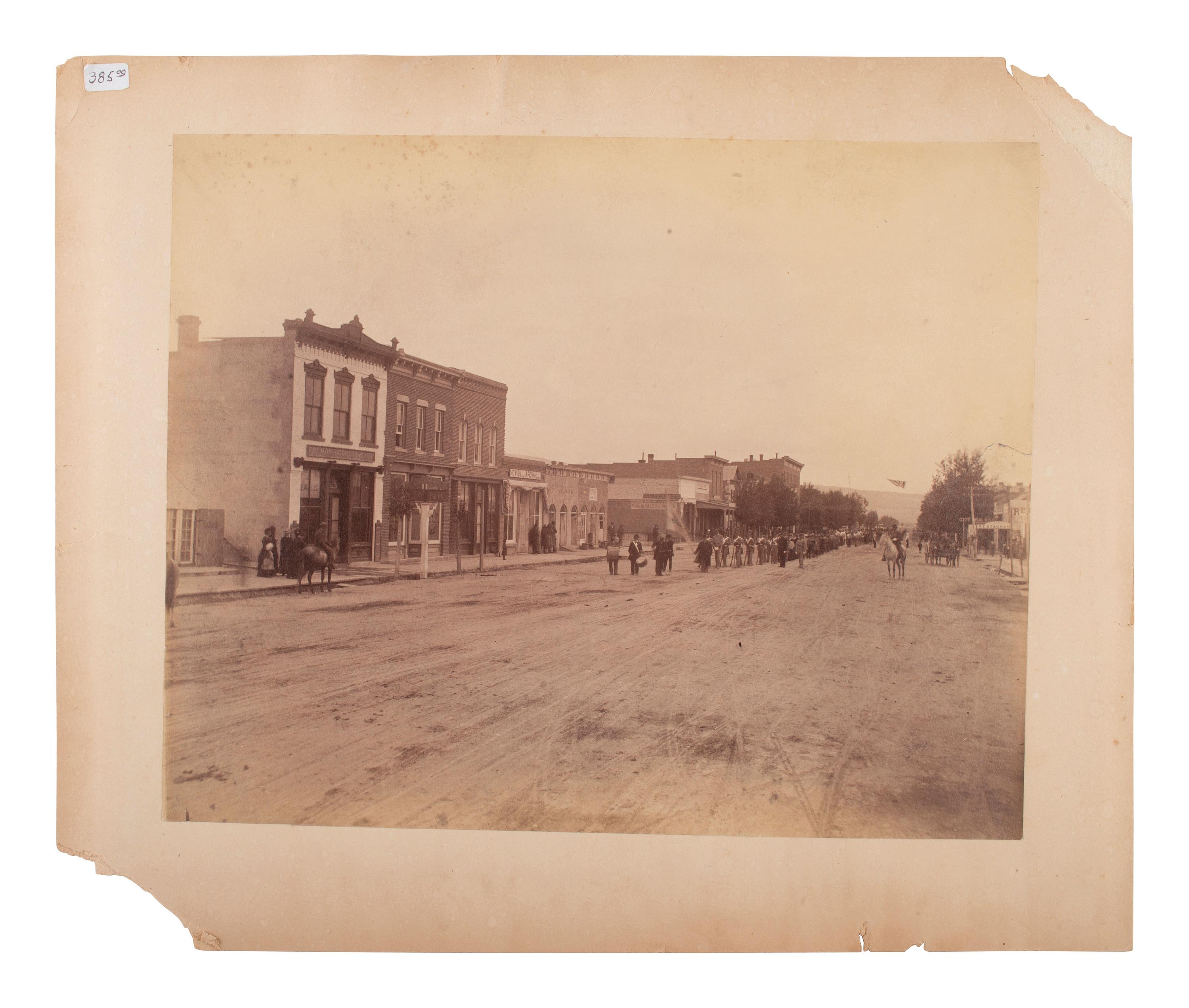[WESTERN AMERICANA]. [JACKSON, W.H., photog.]. 2 photographs, incl. street scene and railroad view.