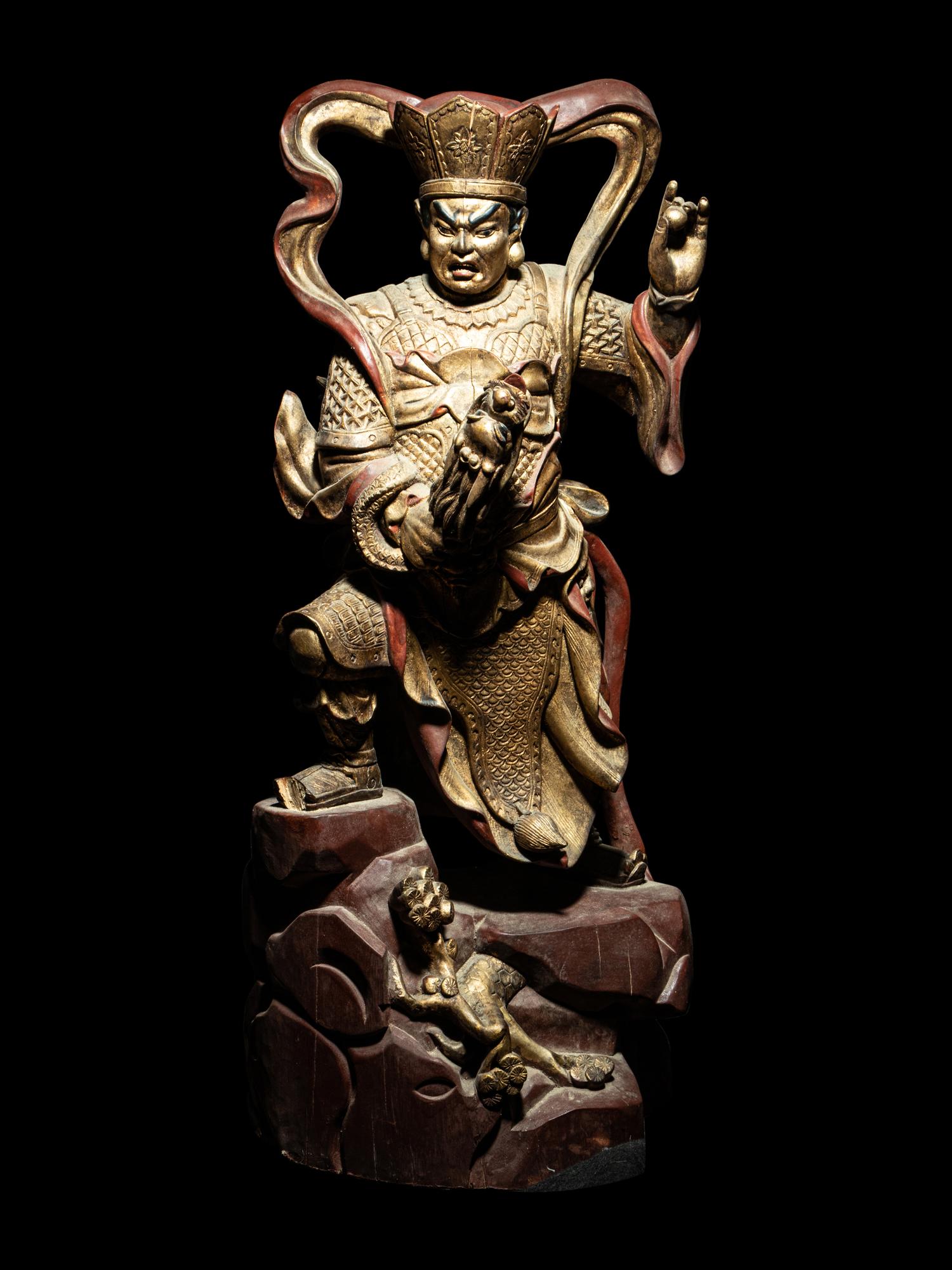 A Set of Four Gilt and Red Lacquered Wood Figures of Guardians